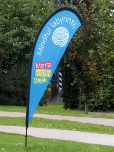 A feather banner marks the site of the 'mindful labyrinth' for Addenbrooke's Hospital Mental Health Resilience Week